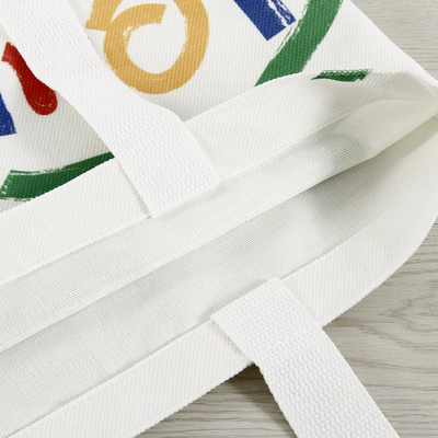 Bolsa de compras de lienzo de color personalizada de gran capacidad con diseño y logotipo de cara sonriente